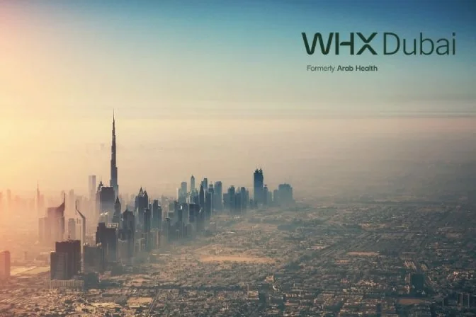 WHX Dubai branding over an aerial view of the Dubai skyline at sunrise